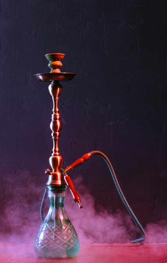 Stylish oriental shisha. Hookah on a beautiful oriental background, smoke