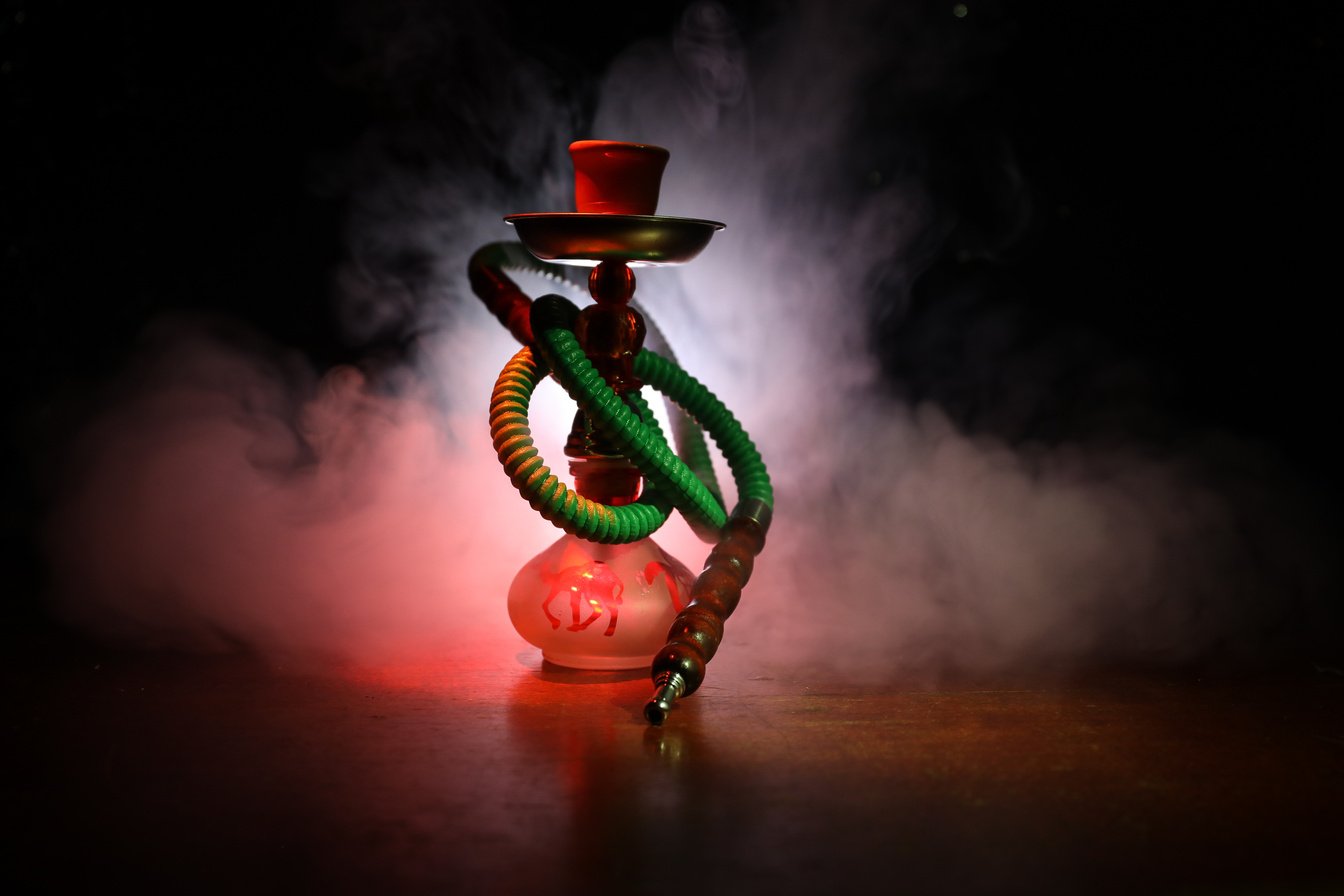 Hookah hot coals on shisha bowl with black background. Stylish oriental shisha. Shisha Concept. Selective focus